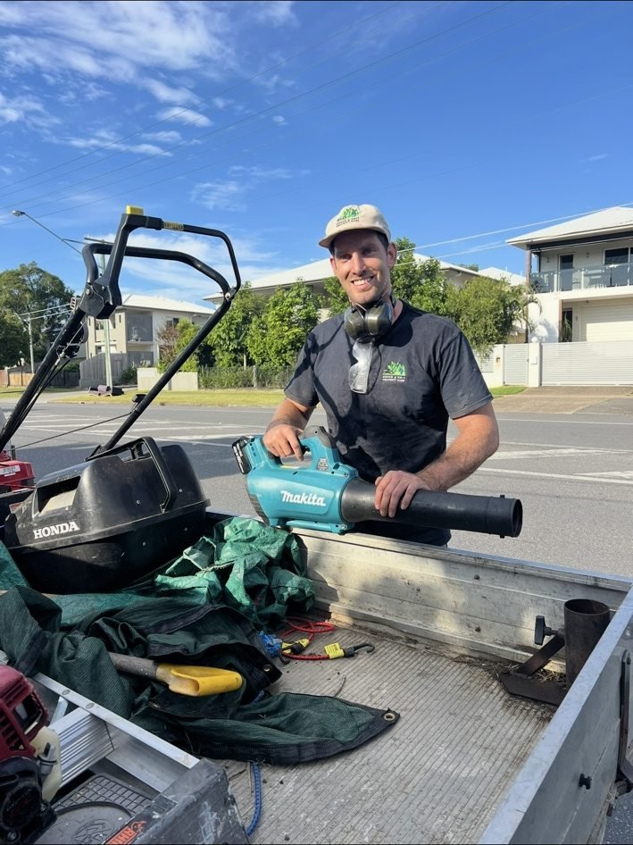 Green and Grit team member with work equipment